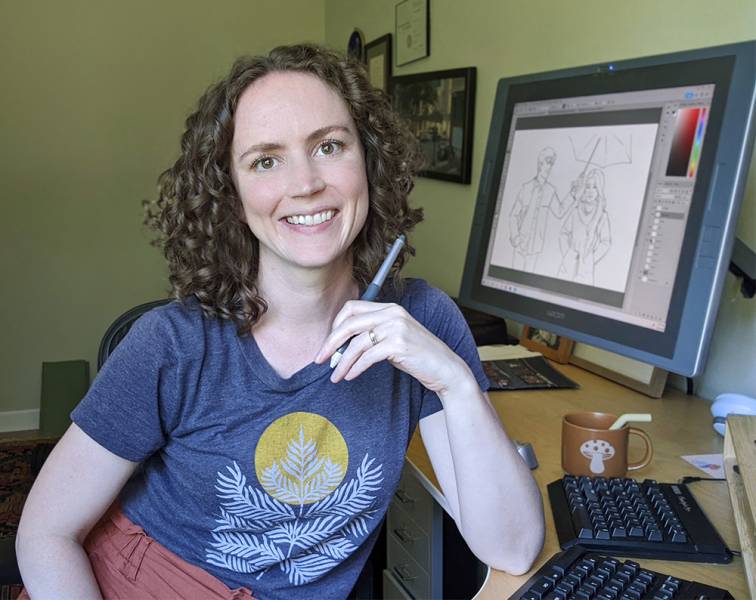 Kelley at her desk with her tablet